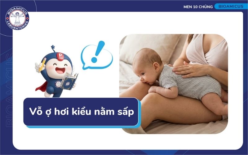 Vỗ ợ hơi ở tư thế cho b&eacute; &uacute;p mặt v&agrave;o đ&ugrave;i người bế